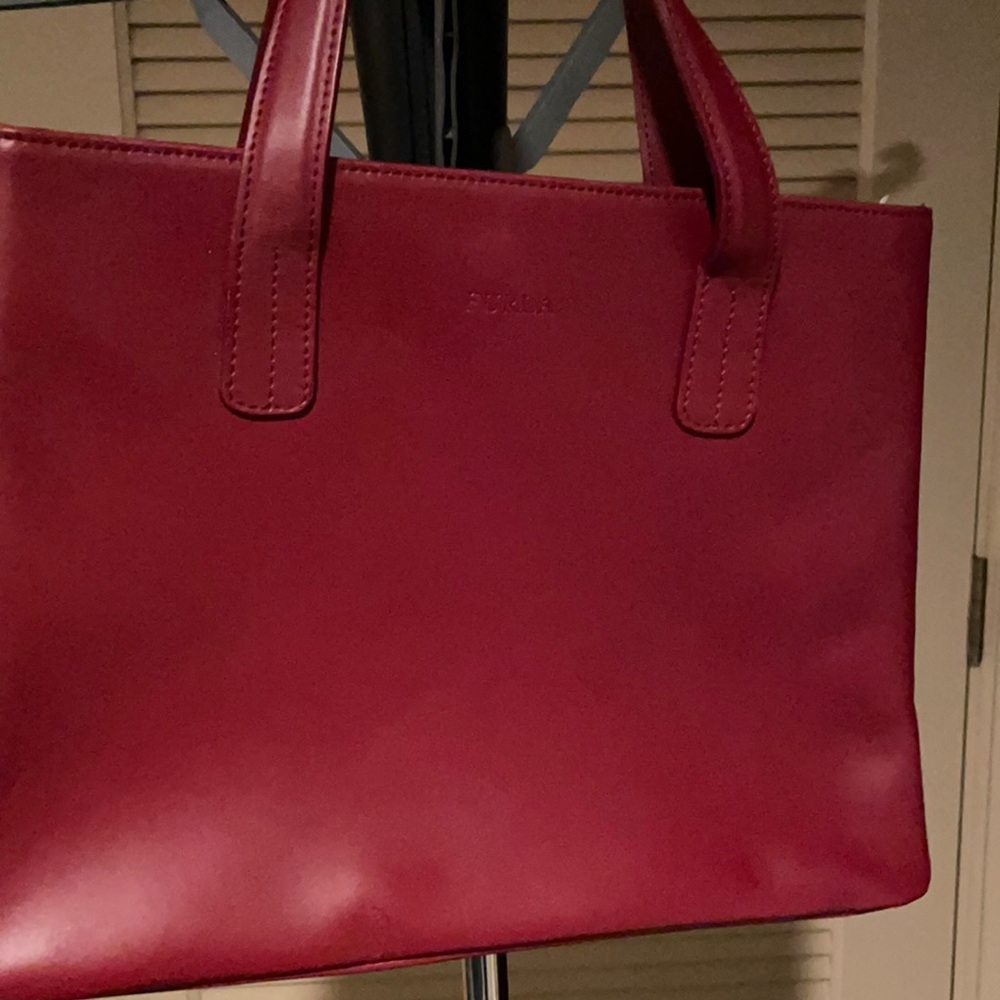 Furla wine color handbag